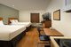 ? HotelDetail_LogoAlt WoodSpring Suites Signature Houston IAH Airport logo