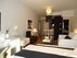 ? HotelDetail_LogoAlt WooTravelling Plaza de Oriente HOMTELS logo